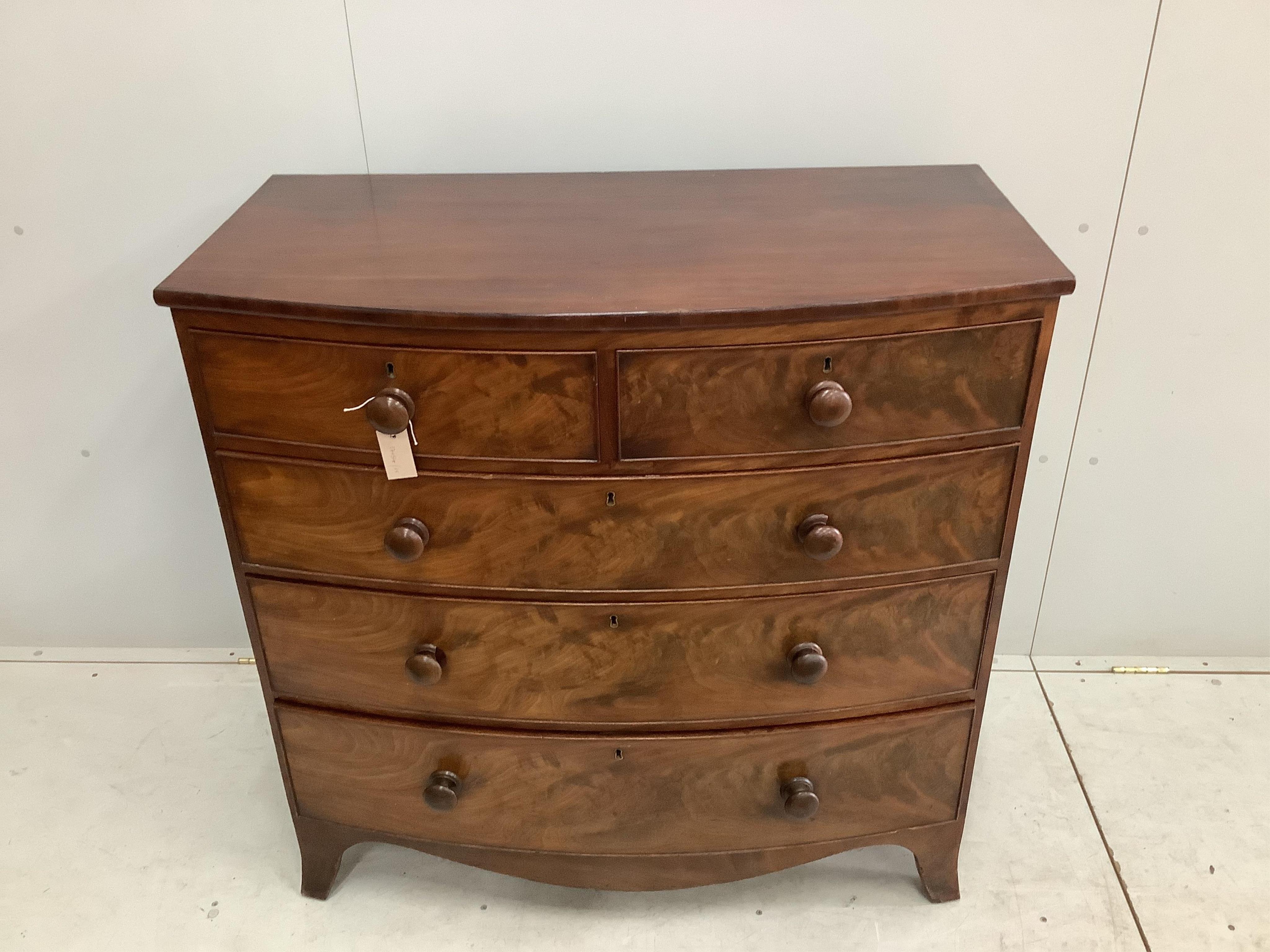 A Regency mahogany bow front chest of drawers, width 105cm, depth 52cm, height 104cm. Condition - fair